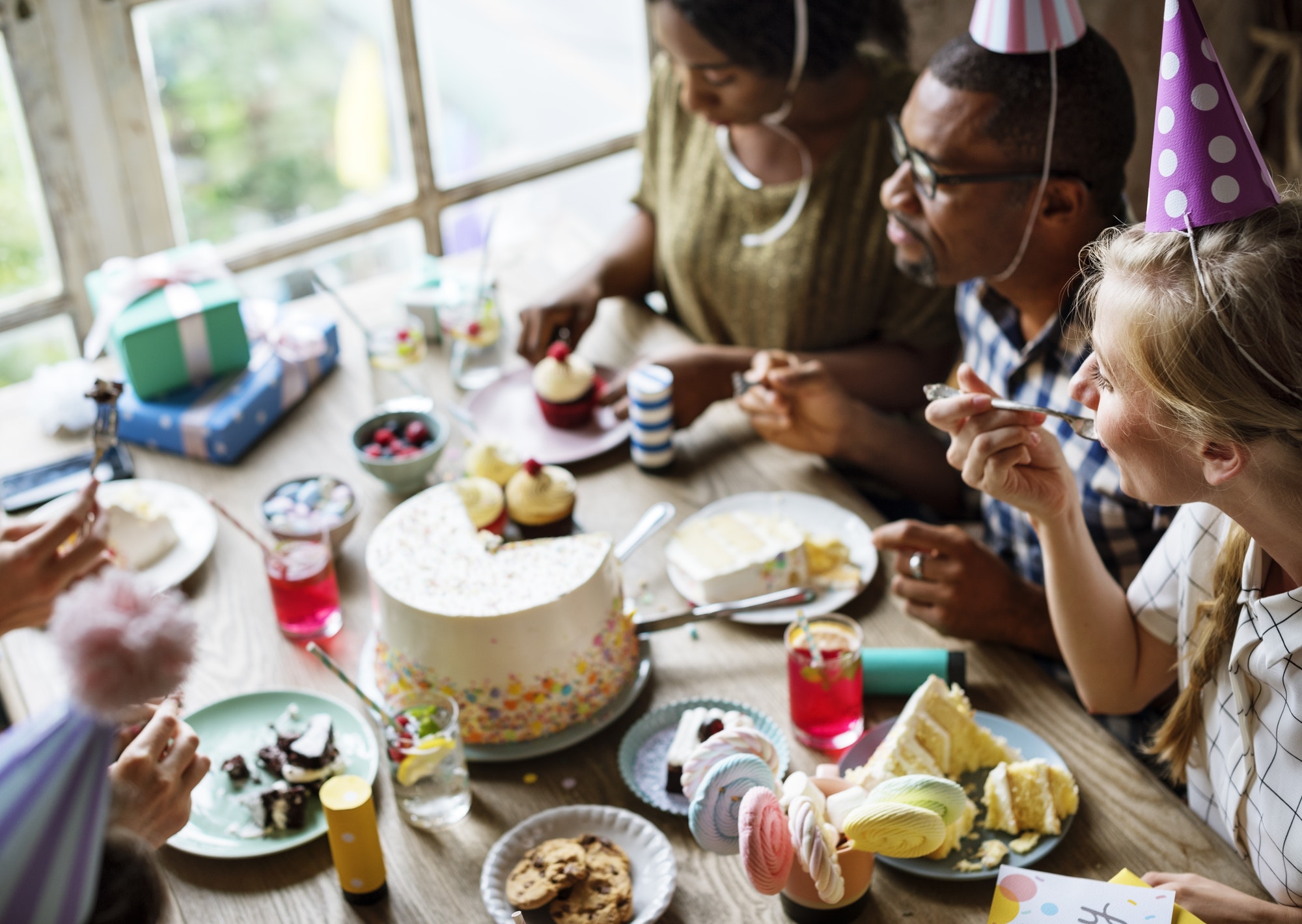 people-eating-cake-on-birthday-party-celebration.jpg